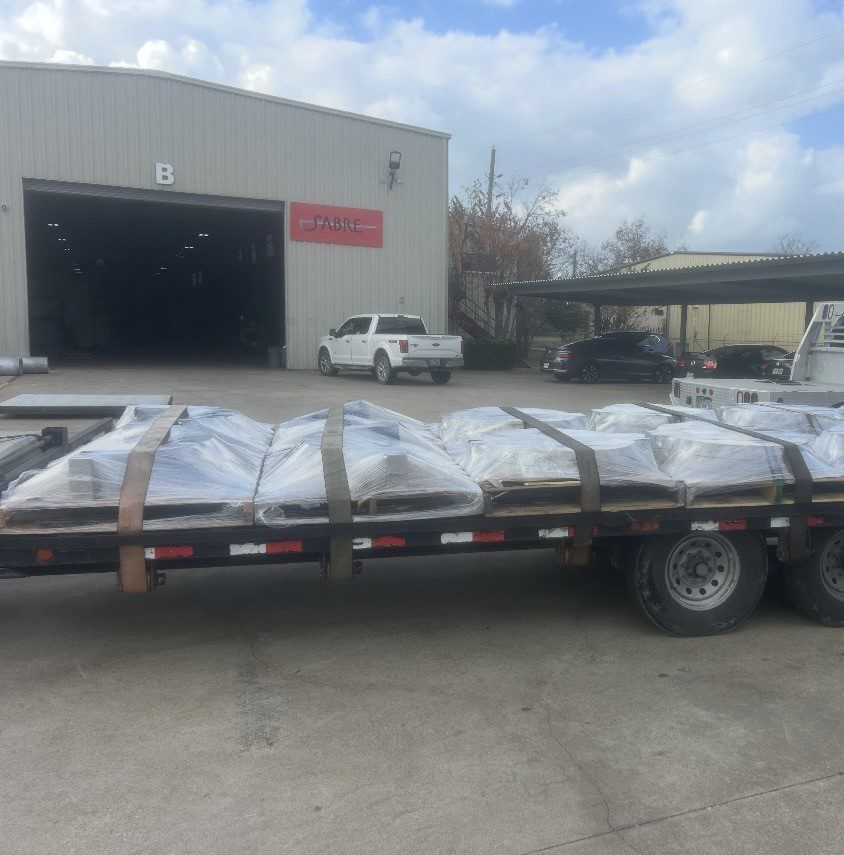 A flatbed trailer loaded with goods for partial freight transport.