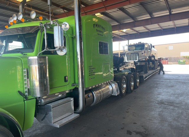 Industrial truck carrying heavy equipment