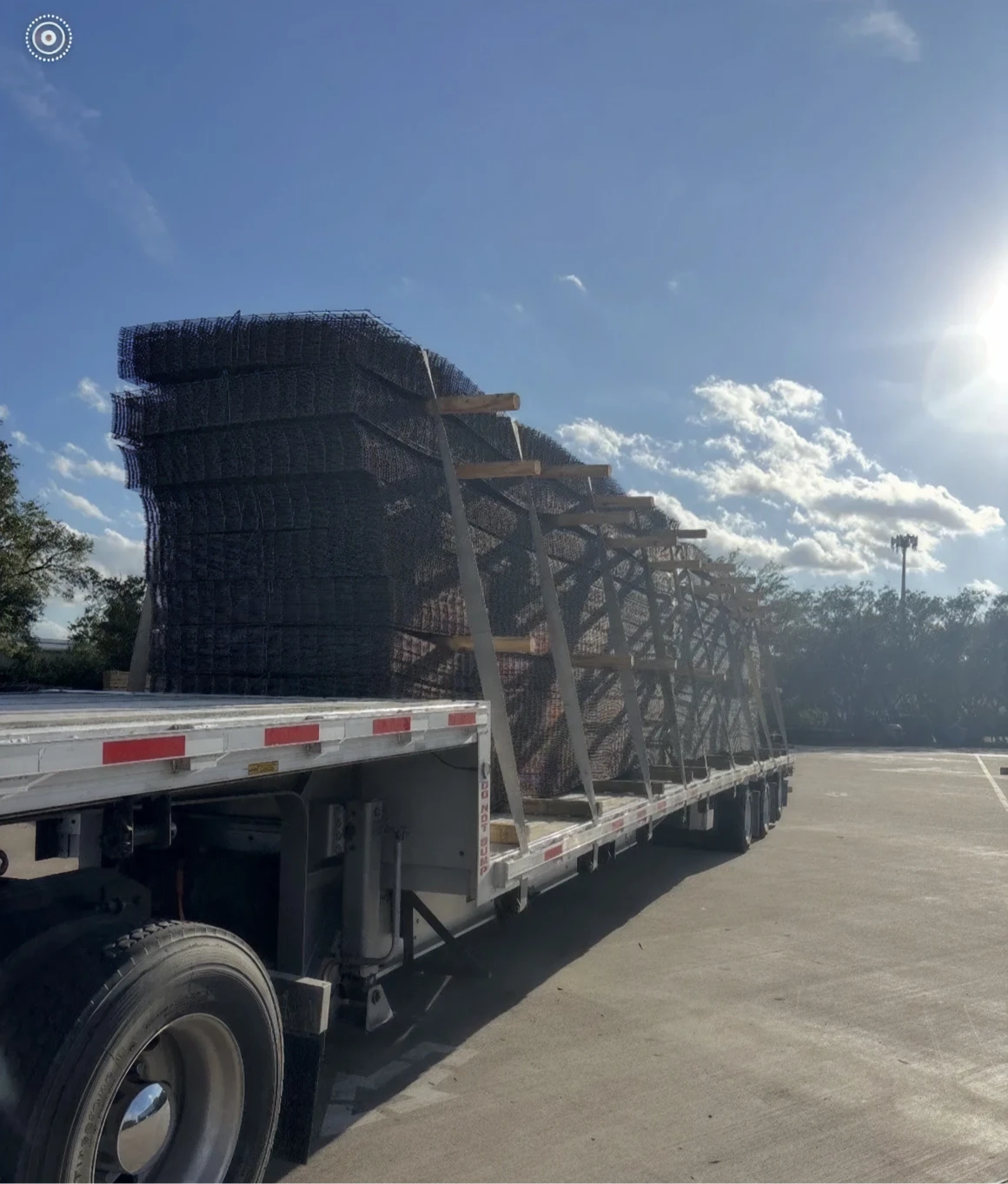 Flatbed truck carrying large metal structures