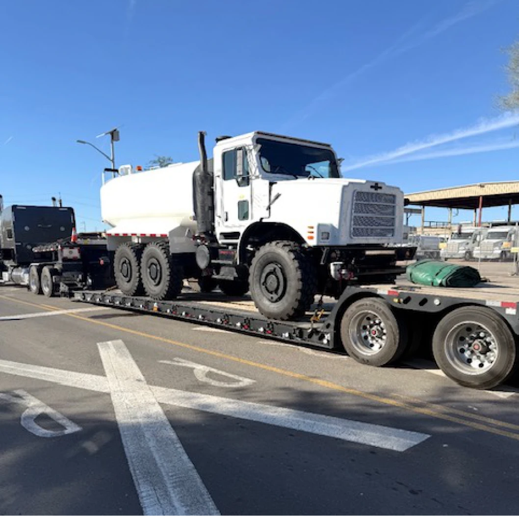 Large vehicle being transported on road